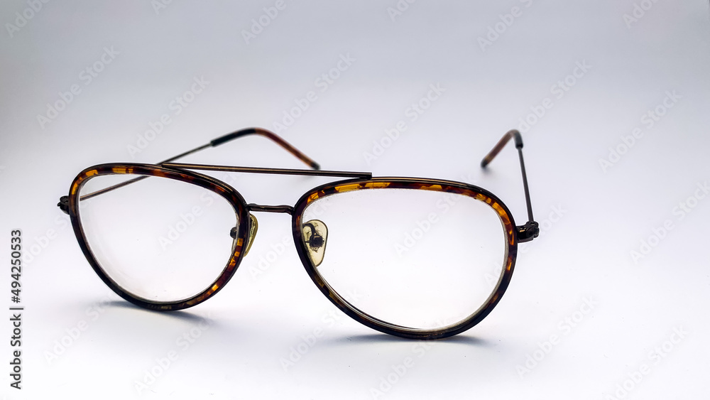 Fototapeta premium striped eyeglasses with a white background. These glasses are usually used when in front of the computer or just reading a book.