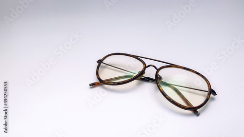 striped eyeglasses with a white background. These glasses are usually used when in front of the computer or just reading a book.