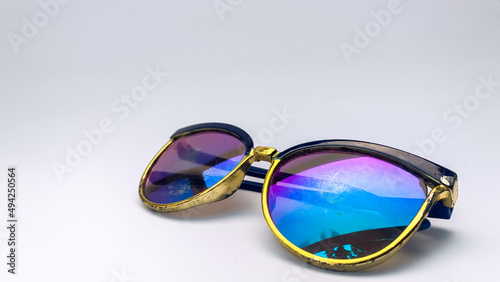 glasses with rainbow glass on a white background. These glasses are usually used when in front of the computer or just reading a book.