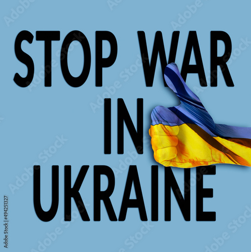 Stop war in Ukraine inscription and thumb up gesture over blue background. hand colored ukrainian flag colors.