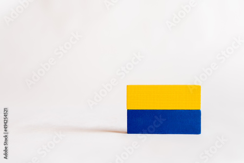 blue and yellow rectangular blocks on white background with copy space, ukrainian concept.
