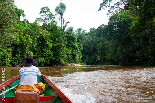 Boat ride through the deep jungle of Borneo