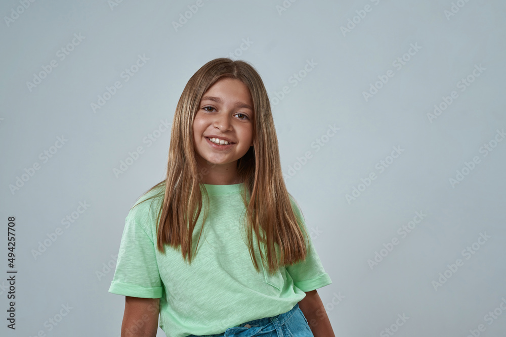 Smiling little girl posing and looking at camera Smiling little girl posing and looking at camera