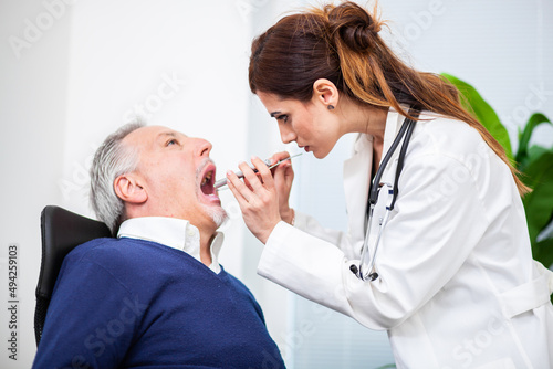 Doctor examining a patient in her office