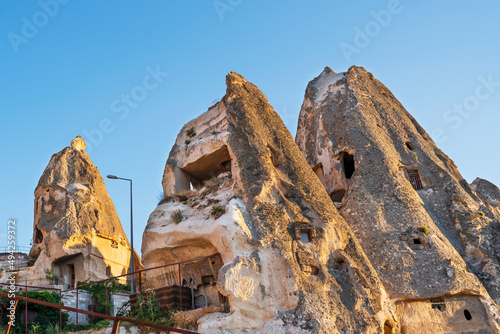 Ancient stone dwellings at sunset in Goreme in Cappadocia, Turkey.