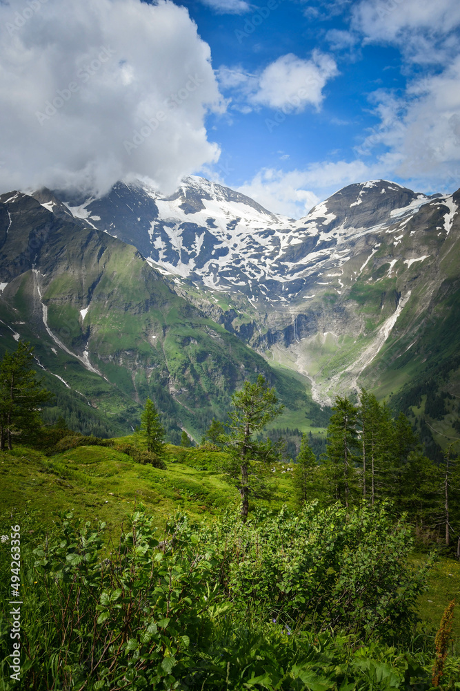 View of the Austria nature - high alpine and lakes in valley. Summer nature with green colors.