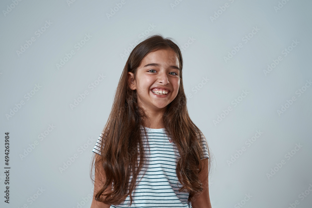 Fototapeta premium Portrait of european little girl looking at camera