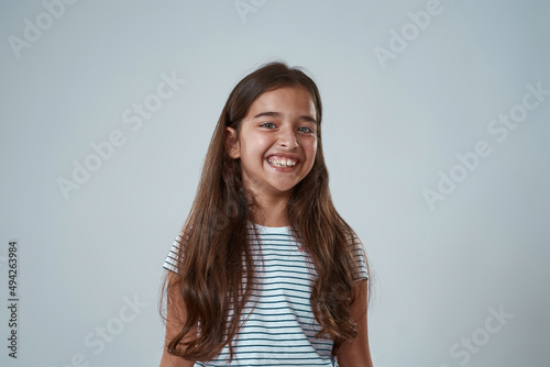 Portrait of european little girl looking at camera