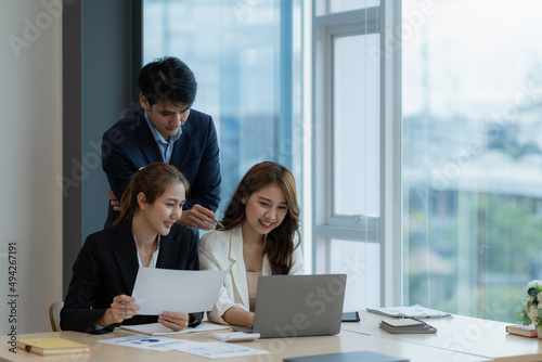 Business People Meeting to discuss and brainstorming the financial report paperwork in home office. Financial advisor teamwork and accounting concept.