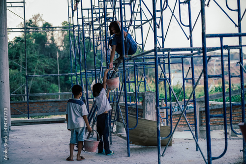 Children are forced to work in construction areas. Human rights concepts, December 10 Stop child abuse, violence, fear of child labor and human trafficking.