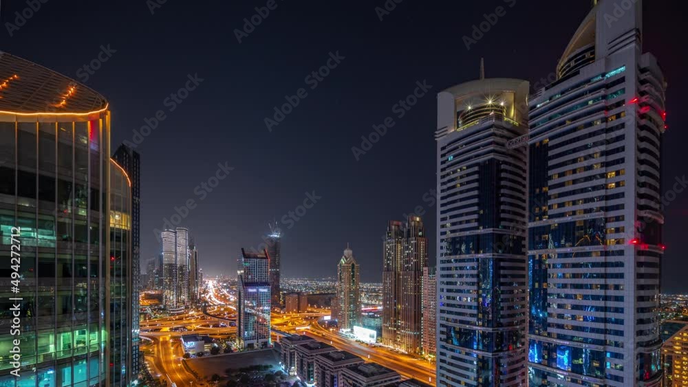 Aerial view of Dubai International Financial District with many skyscrapers night timelapse. Aerial view of Dubai International Financial District with many skyscrapers night timelapse.