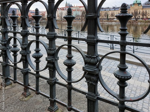 Metal railings on the Vltava river embankment in Prague