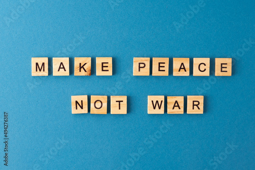 Make peace not war background. Phrase from wooden letters. Top view words. The phrases is laid out in wood letter. Motivation.