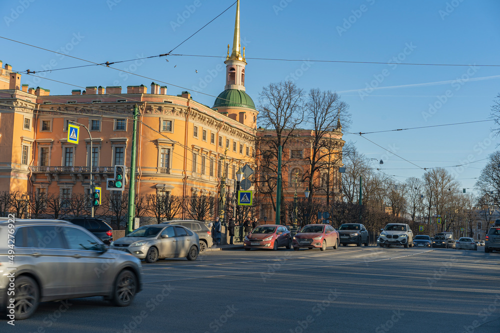 20/03/2022 16:55 PM Russia St. Petersburg Moika river embankment, daytime car traffic. Michalovsky Castle.