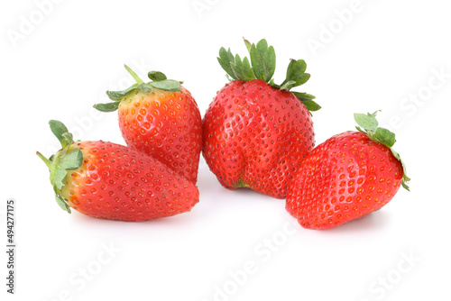 Four strawberries isolated on white