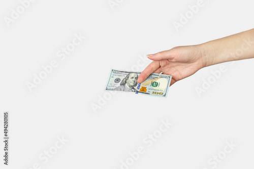 Closeup hand giving money isolated on white background. Money Financial and Payment Concept.