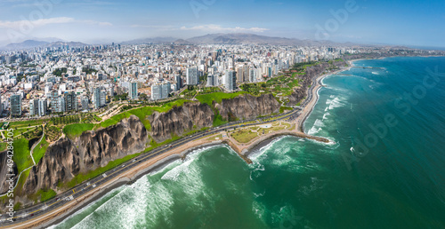 LIMA, PERU: Aerial view of Miraflores town, cliff and the Costa Verde high way photo