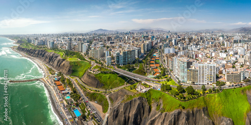 LIMA, PERU: Aerial view of Miraflores town, cliff and the Costa Verde high way