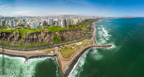 LIMA, PERU: Aerial view of Miraflores town, cliff and the Costa Verde high way
