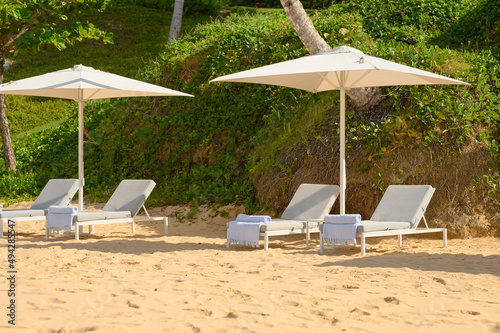 Fototapeta Naklejka Na Ścianę i Meble -  Sun loungers on the beach for relaxation in the Dominican Republic-3