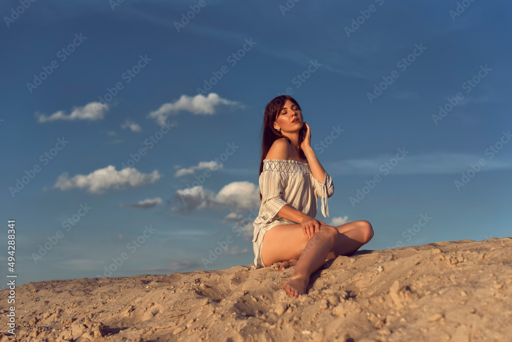 Young brunette woman on a sunny summer day Young brunette woman on a sunny summer day