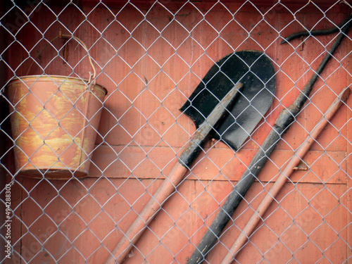 Fire shield of primary fire extinguishing means. And a tool used in the elimination of small fires and fires in the initial stage. Bayonet shovel, hook, crowbar and bucket behind the net.