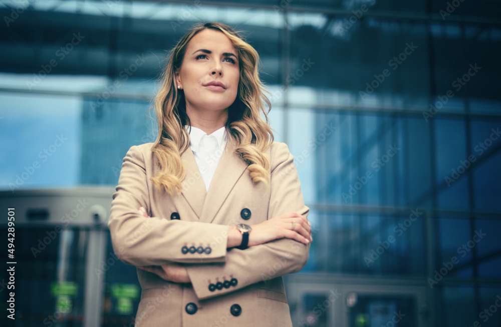 Confident young female manager outdoor in a modern urban setting Confident young female manager outdoor in a modern urban setting