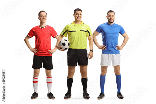Football players from opposite teams and a referee holding a ball