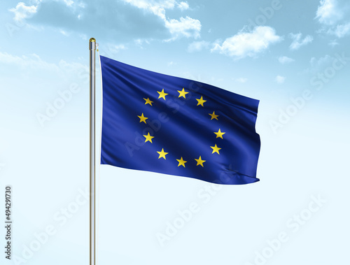 European union national flag waving in blue sky with clouds. European union flag. 3D illustration