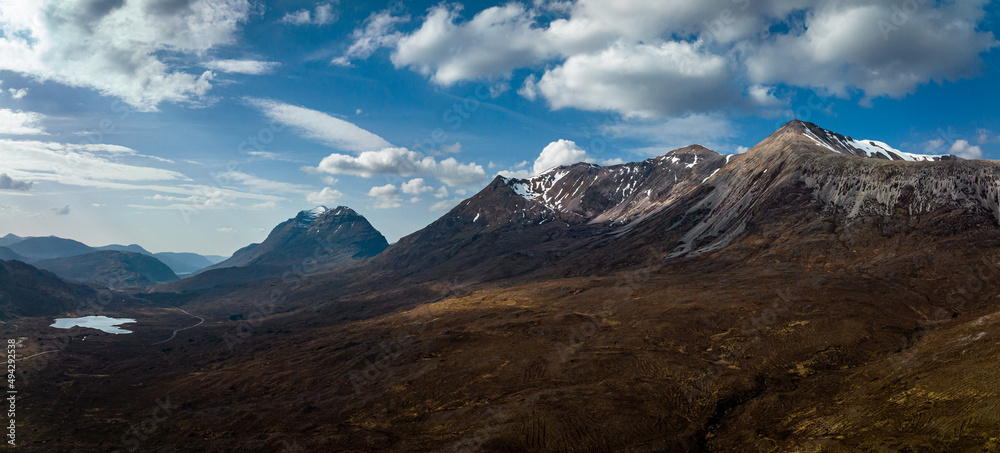 aerial view of the torridon mountains in the north west highlands of scotland during a clear blue spring day