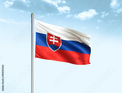 Slovakia national flag waving in blue sky with clouds. Slovakia flag. 3D illustration