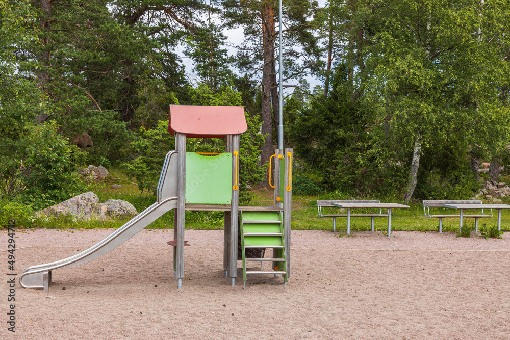 Beautiful view of slide on empty playground on summer day. Sweden. Beautiful view of slide on empty playground on summer day. Sweden.