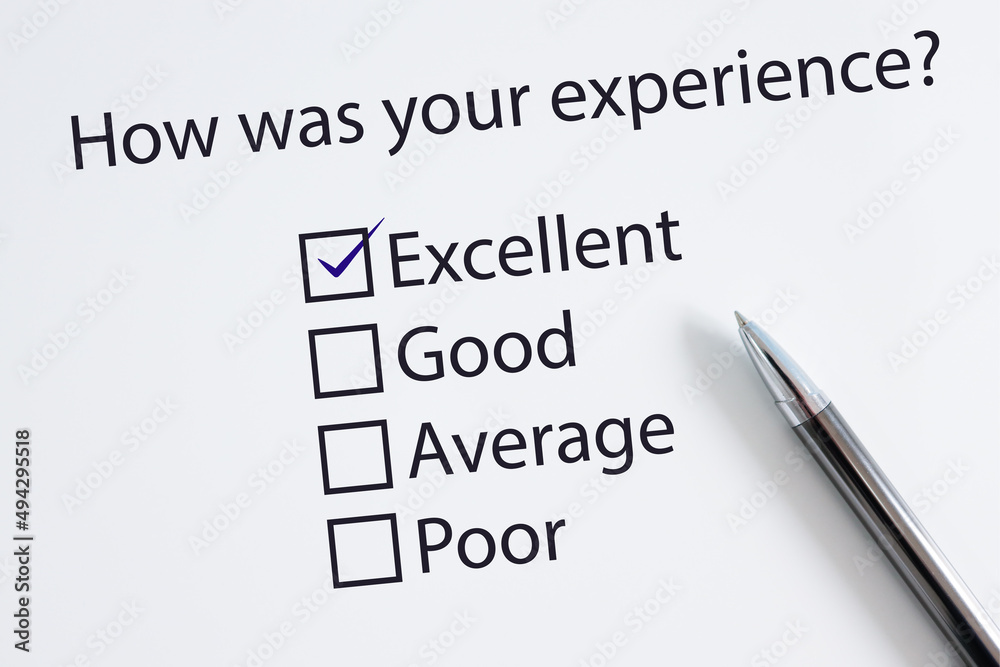 Survey form with a tick placed in Excellent checkbox. Customer Experience Concept. Survey form with a tick placed in Excellent checkbox. Customer Experience Concept.