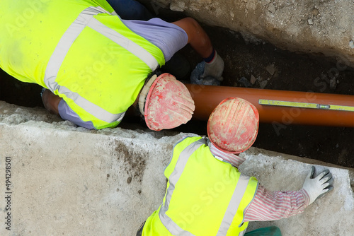 construction workers for repair water  and  sewer pipes in construction site