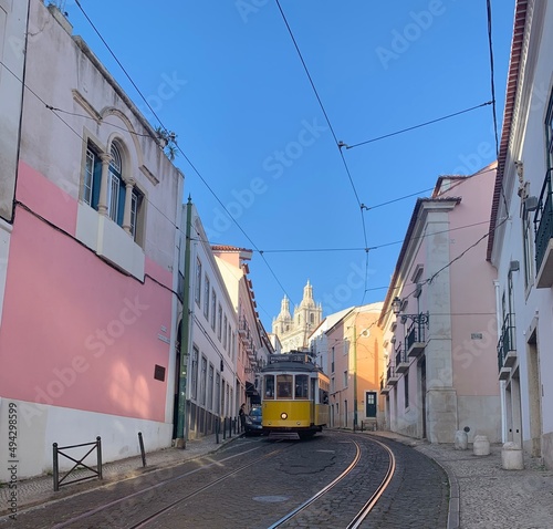 The famous tram #28 moving through the streets of Lisbon Portugal