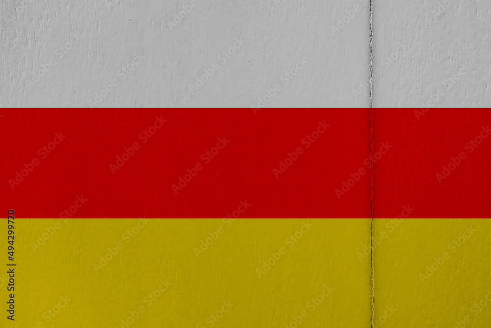 Patriotic wooden background in colors of national flag. South Ossetia