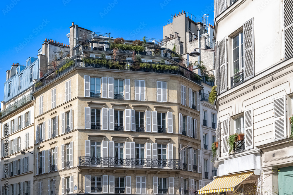 Paris, luxury parisian facade rue de Fleurus in the 6e arrondissement, with terraces on the rooftop
