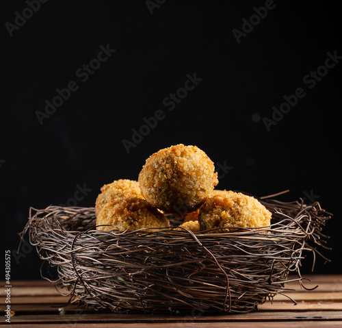cheese balls and breadcrumbs in the bird's nest