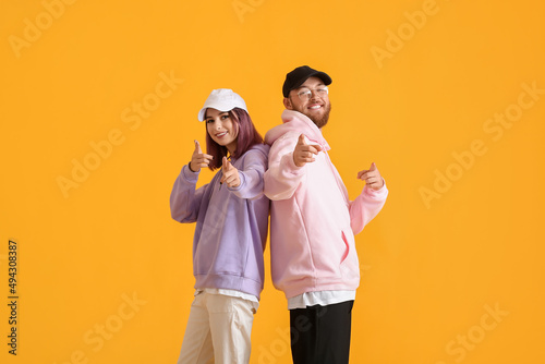 Cool young couple in hoodie...