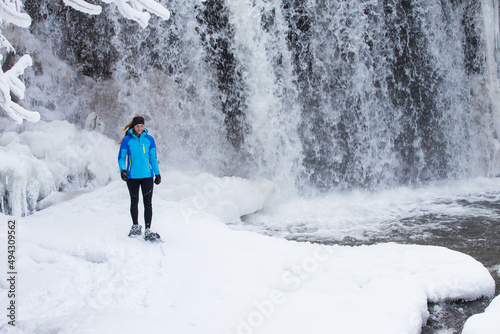 Obraz na płótnie Beautiful woman on snowshoes in the forest in the winter in Canada. w salonie