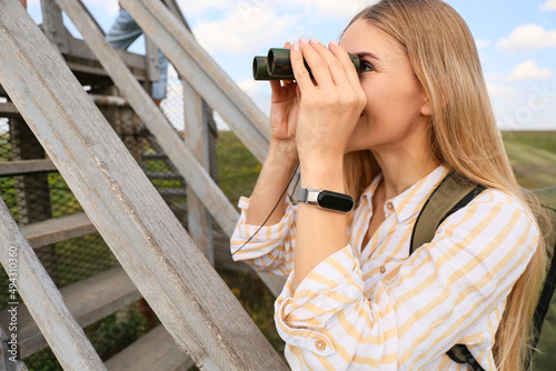 Beautiful female tourist wi...