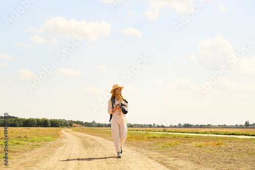 Beautiful female tourist wi...