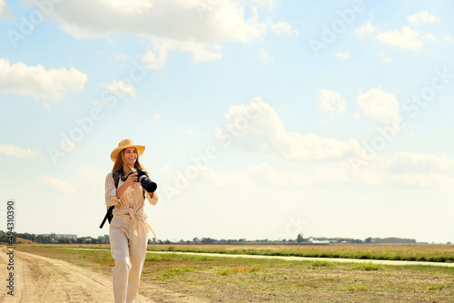 Beautiful female tourist wi...
