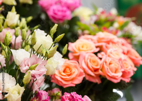 A beautiful bright bouquet of blooming fresh roses for a gift collected by an experienced florist