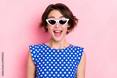 Photo of impressed millennial brunette lady wear eyewear blue top isolated on pink color background
