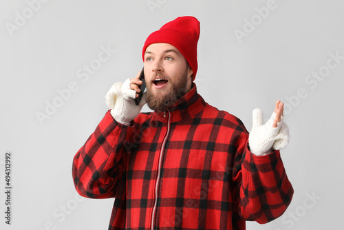 Young bearded man in warm g...