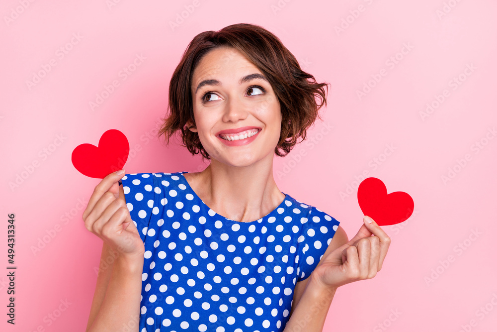 Photo of hooray young brunette lady hold hearts look promo wear blue blouse isolated on pink color background Photo of hooray young brunette lady hold hearts look promo wear blue blouse isolated on pink color background