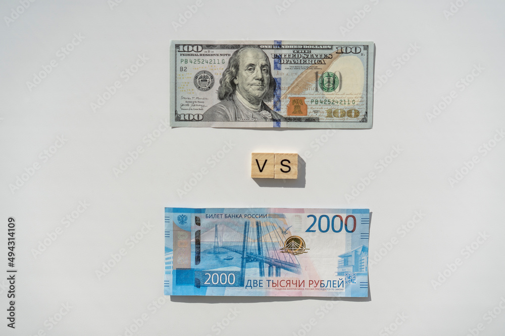 Dollar and ruble banknotes. Confrontation of two currencies