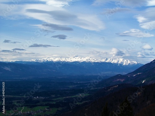 View of snow covered peaks of the Julian alps and Gorenjska region of Slovenia with mountain Triglav in the middle