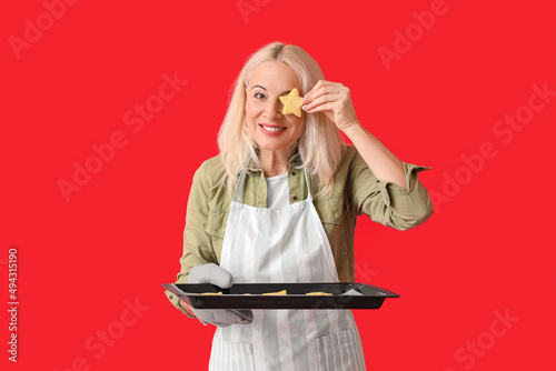 Mature woman holding baking...